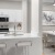 a kitchen with white cabinets