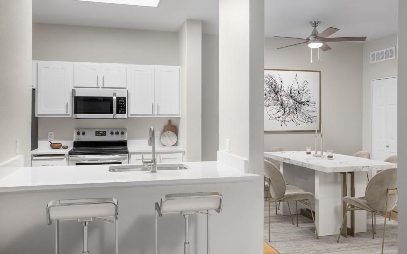 a kitchen with white cabinets
