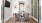 private room with table, chairs, and mounted tv