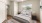a bedroom with a large window