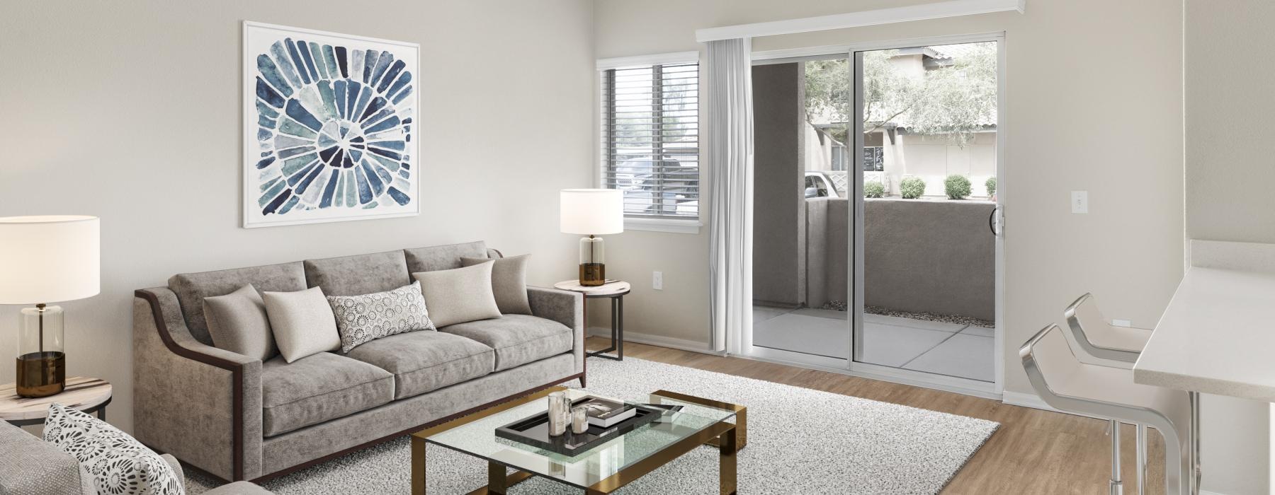 a living room with a glass door to patio