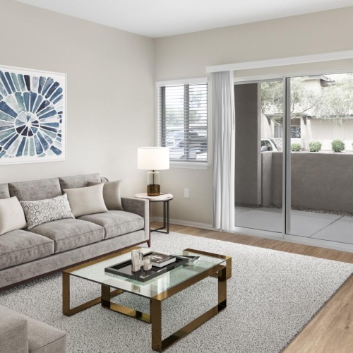 Wide open living areas flooded with natural light a living room with a glass door to patio